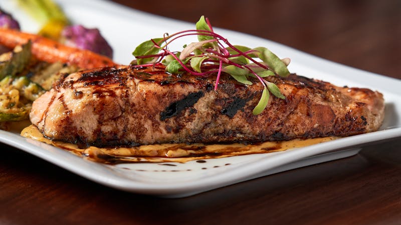 Pan-seared salmon with vegetables and lemon