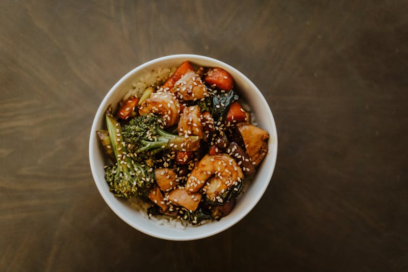 Teriyaki chicken rice bowl with vegetables and sesame