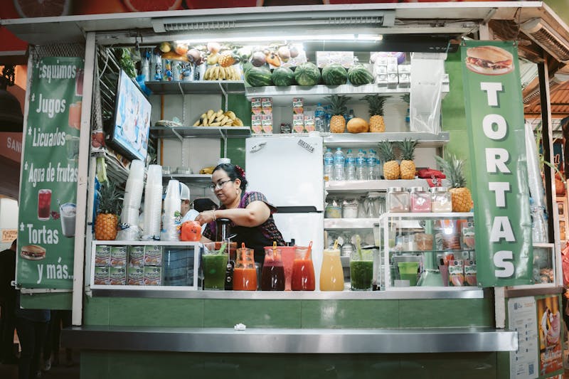 Mango hibiscus agua fresca in a tall glass